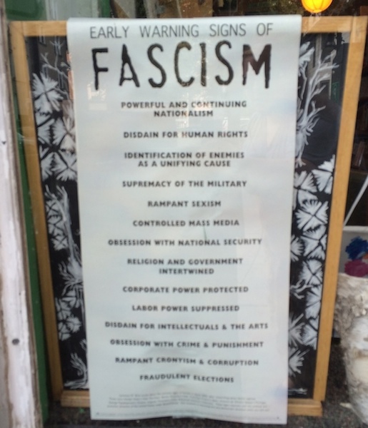poster that lists early warning signs of fascism