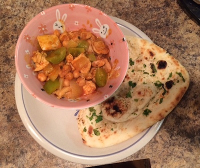 chicken and chana masala with a side of garlic naan