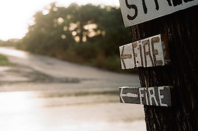 Handmade signs that read 'fire' with arrows.